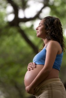 blissful and thankful pregnant woman in her last month of pregnancy