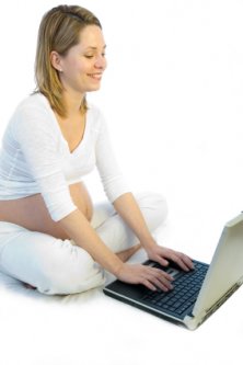pregnant women exploring the internet from her laptop