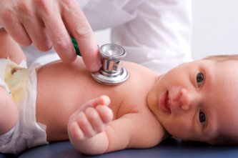 Doctor testing newborn baby